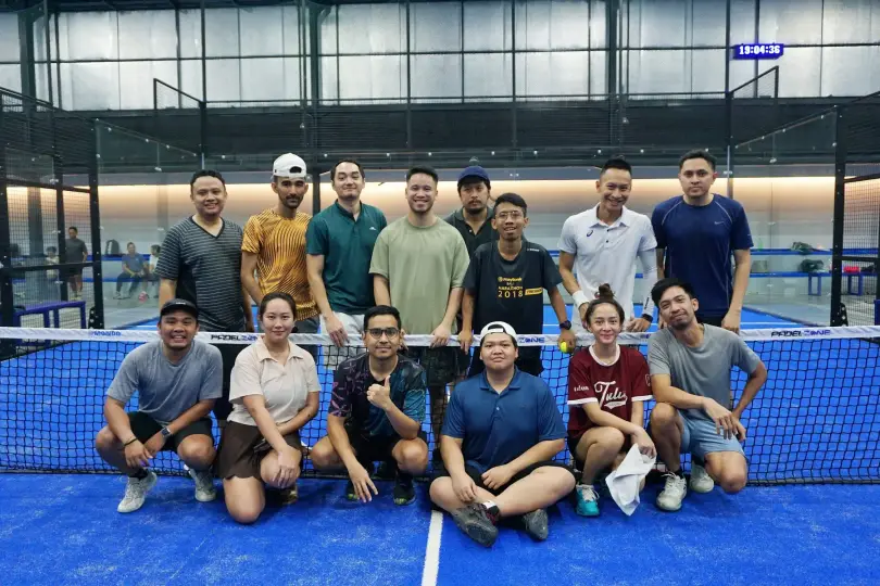 A group photo at the net